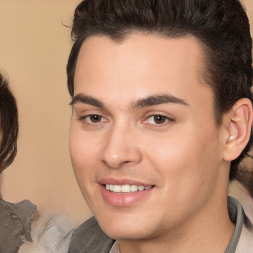 Joyful white young-adult male with medium  brown hair and brown eyes