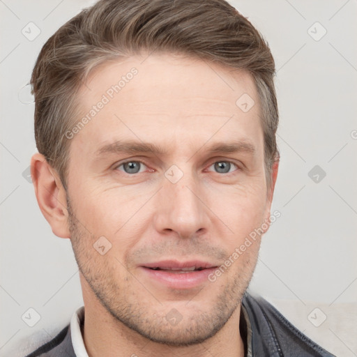 Joyful white adult male with short  brown hair and grey eyes