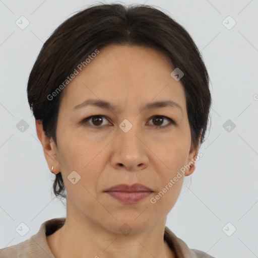 Joyful asian adult female with medium  brown hair and brown eyes