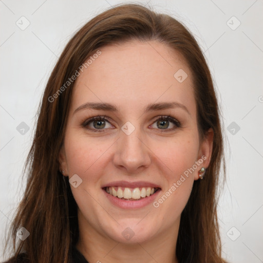 Joyful white young-adult female with long  brown hair and green eyes