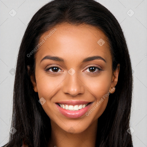 Joyful latino young-adult female with long  brown hair and brown eyes