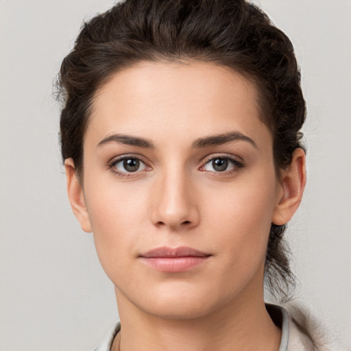 Neutral white young-adult female with short  brown hair and brown eyes