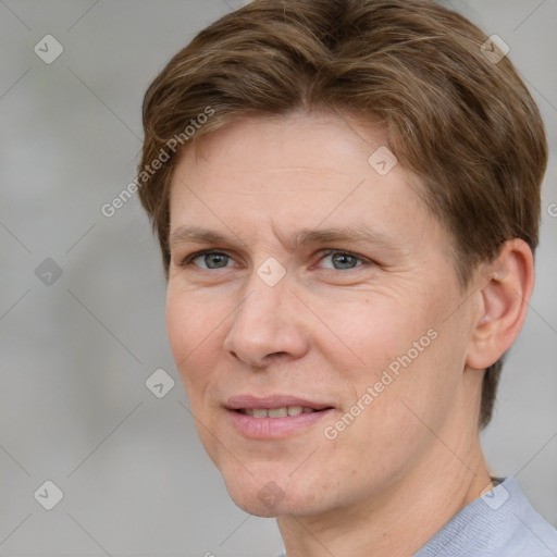 Joyful white adult female with short  brown hair and grey eyes