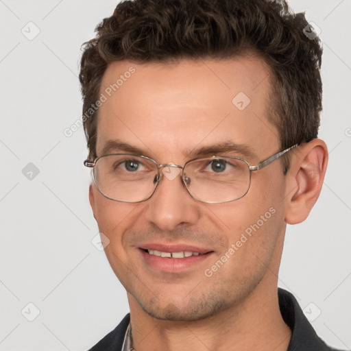 Joyful white adult male with short  brown hair and brown eyes