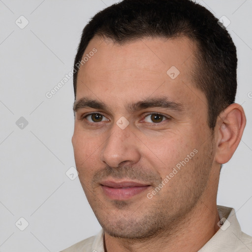 Joyful white young-adult male with short  brown hair and brown eyes