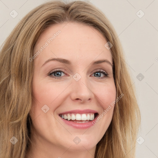 Joyful white young-adult female with long  brown hair and green eyes