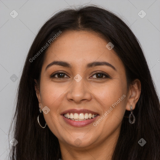 Joyful latino young-adult female with long  brown hair and brown eyes