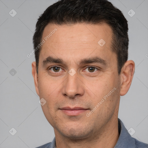 Joyful white adult male with short  brown hair and brown eyes