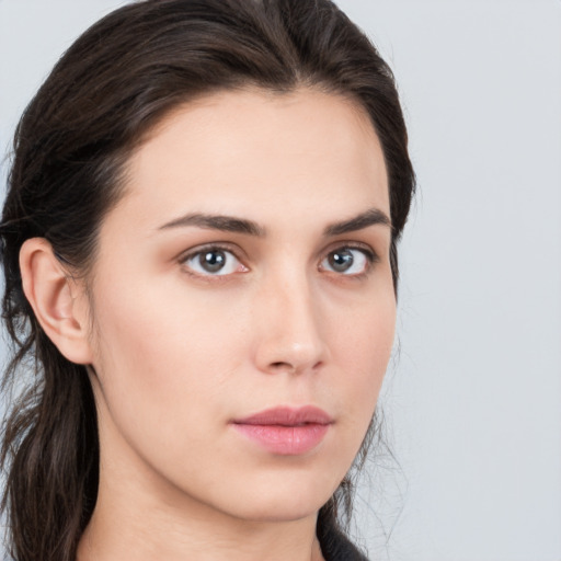 Neutral white young-adult female with long  brown hair and brown eyes