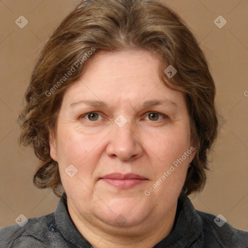 Joyful white adult female with medium  brown hair and grey eyes