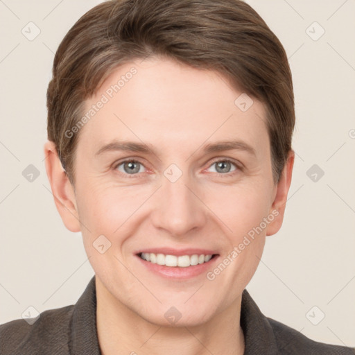 Joyful white young-adult female with short  brown hair and grey eyes