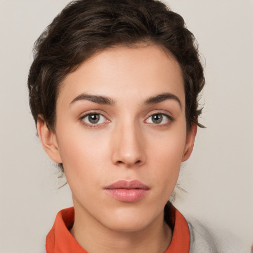 Neutral white young-adult female with short  brown hair and brown eyes