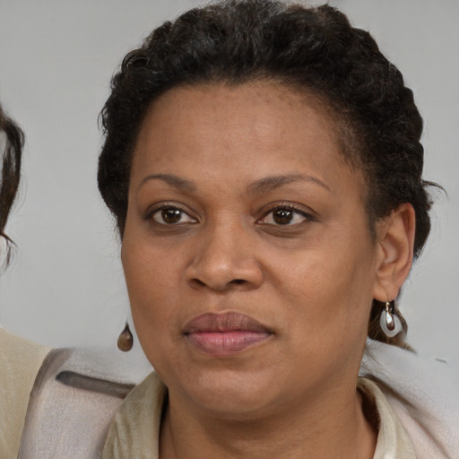 Joyful latino adult female with short  brown hair and brown eyes