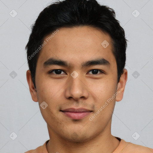 Joyful asian young-adult male with short  black hair and brown eyes