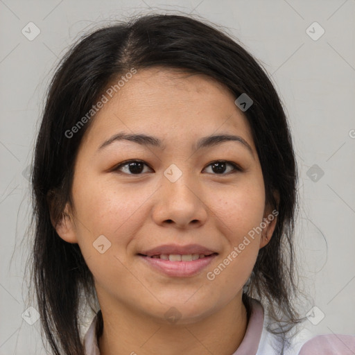 Joyful latino young-adult female with medium  brown hair and brown eyes