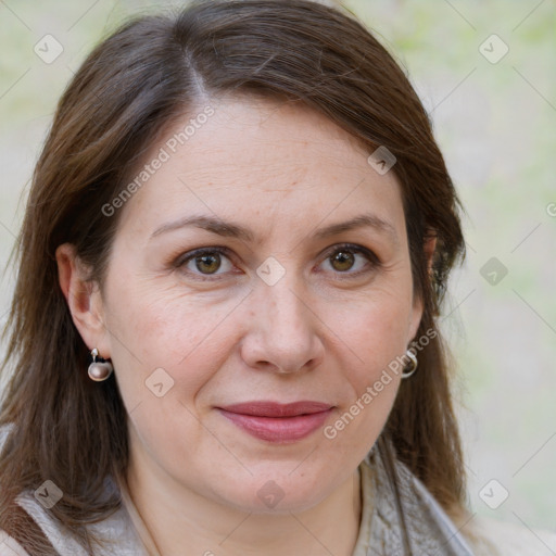 Joyful white adult female with medium  brown hair and brown eyes