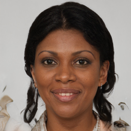 Joyful black adult female with medium  black hair and brown eyes
