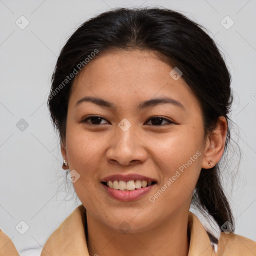 Joyful asian young-adult female with medium  brown hair and brown eyes