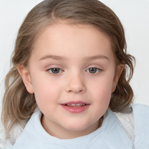 Joyful white child female with medium  brown hair and blue eyes