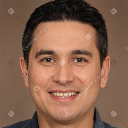 Joyful white adult male with short  black hair and brown eyes