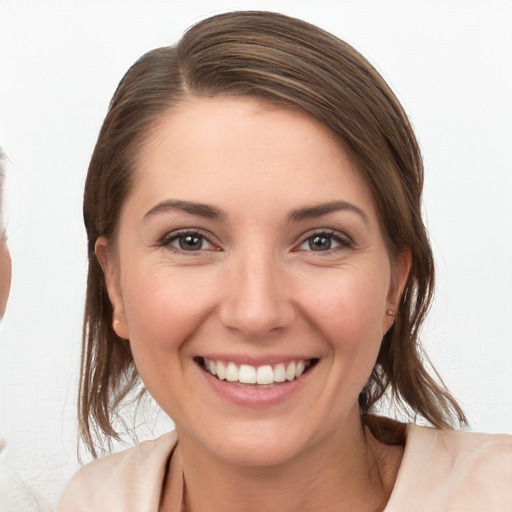 Joyful white young-adult female with medium  brown hair and brown eyes