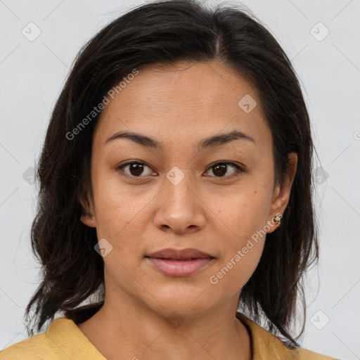 Joyful latino young-adult female with medium  brown hair and brown eyes