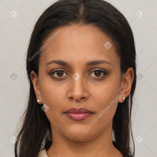 Joyful latino young-adult female with long  brown hair and brown eyes