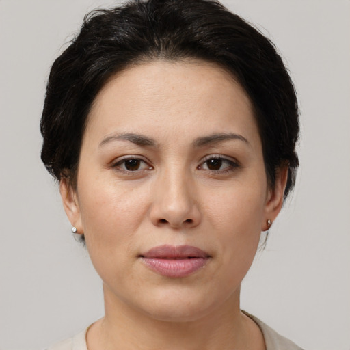 Joyful asian young-adult female with medium  brown hair and brown eyes