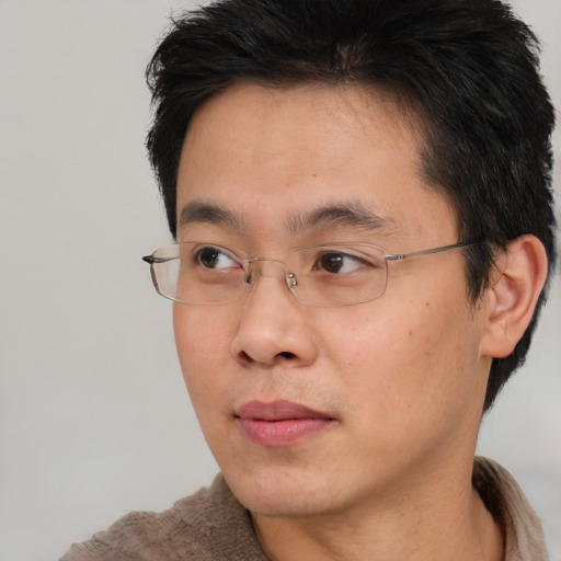 Neutral asian young-adult male with short  brown hair and brown eyes