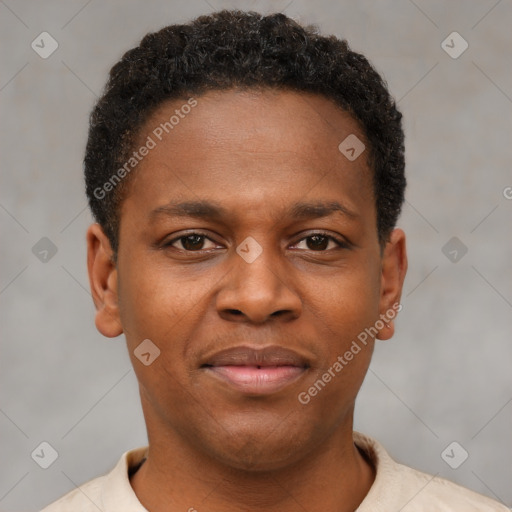 Joyful black young-adult male with short  brown hair and brown eyes