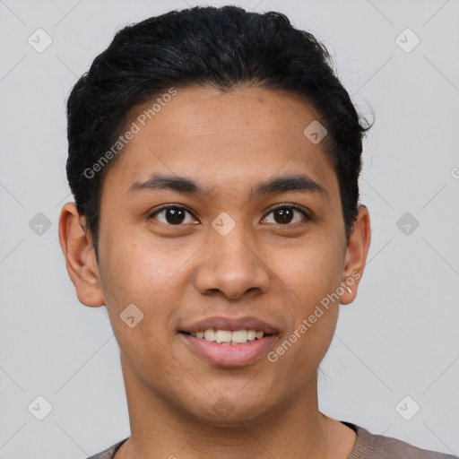 Joyful latino young-adult male with short  brown hair and brown eyes