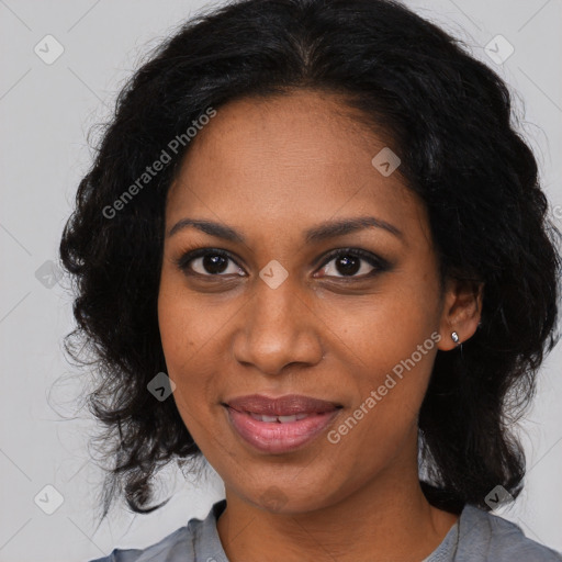 Joyful black adult female with medium  brown hair and brown eyes