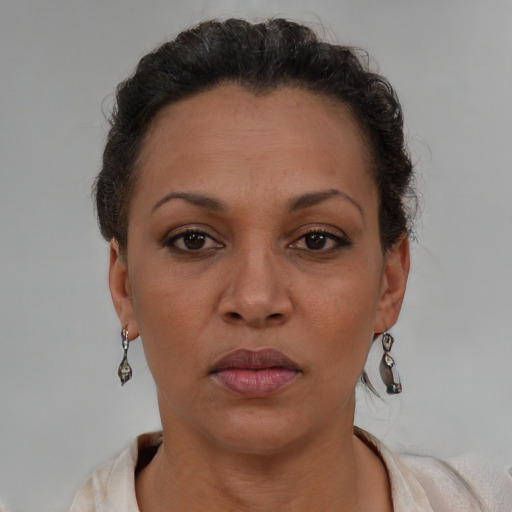 Neutral black adult female with short  brown hair and brown eyes