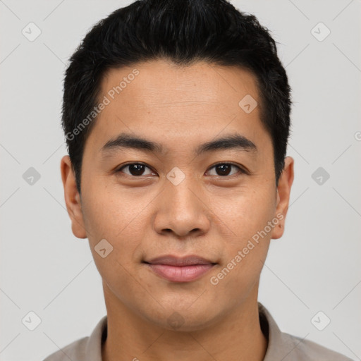 Joyful latino young-adult male with short  brown hair and brown eyes