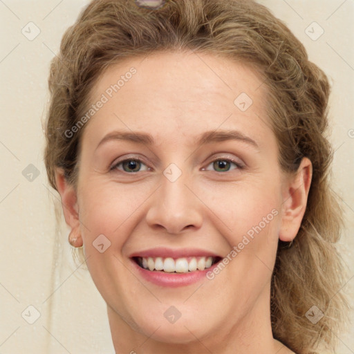 Joyful white young-adult female with long  brown hair and green eyes