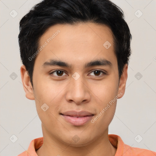 Joyful latino young-adult male with short  brown hair and brown eyes