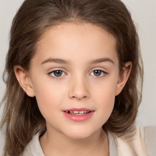 Joyful white child female with medium  brown hair and brown eyes