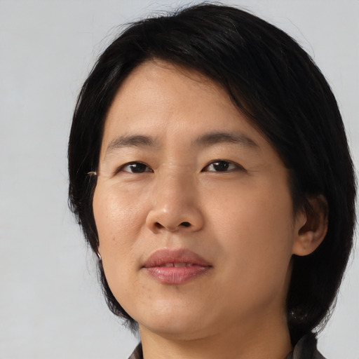 Neutral asian young-adult female with medium  black hair and brown eyes