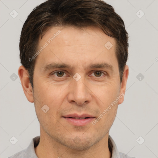 Joyful white adult male with short  brown hair and brown eyes