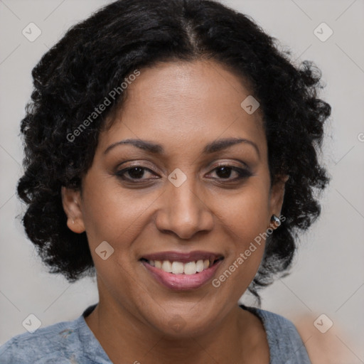 Joyful latino adult female with short  brown hair and brown eyes