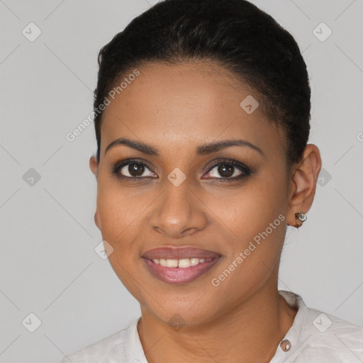 Joyful black young-adult female with short  brown hair and brown eyes