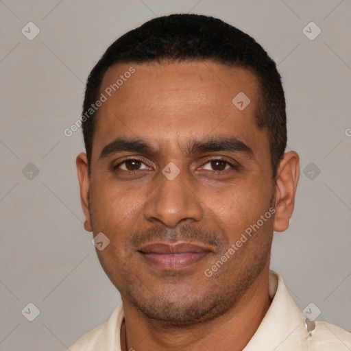 Joyful black young-adult male with short  black hair and brown eyes