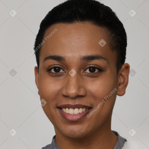 Joyful latino young-adult female with short  black hair and brown eyes