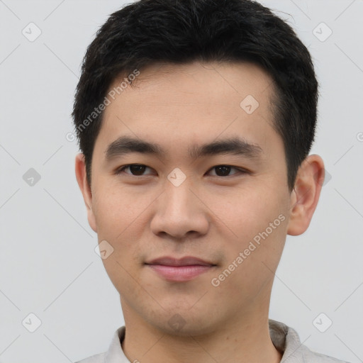 Joyful white young-adult male with short  black hair and brown eyes