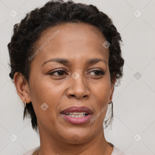 Joyful black adult female with short  brown hair and brown eyes