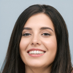 Joyful white young-adult female with long  black hair and brown eyes