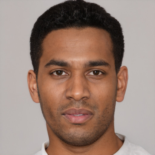 Neutral black young-adult male with short  black hair and brown eyes