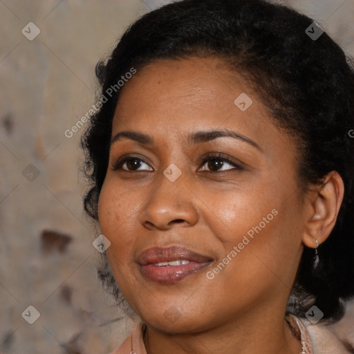 Joyful black young-adult female with medium  brown hair and brown eyes