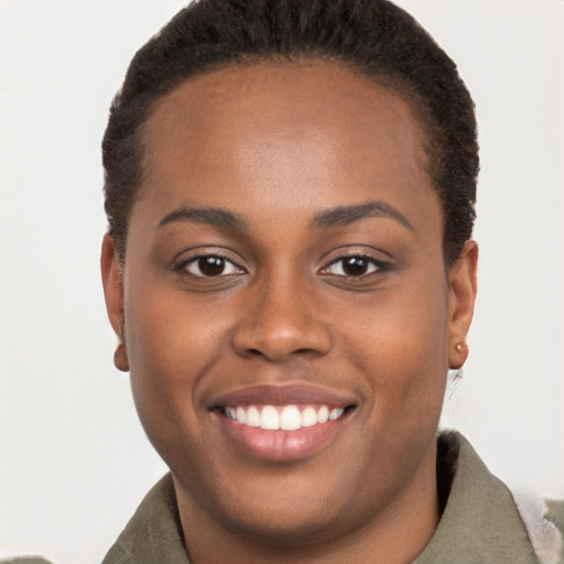 Joyful black young-adult female with short  brown hair and brown eyes