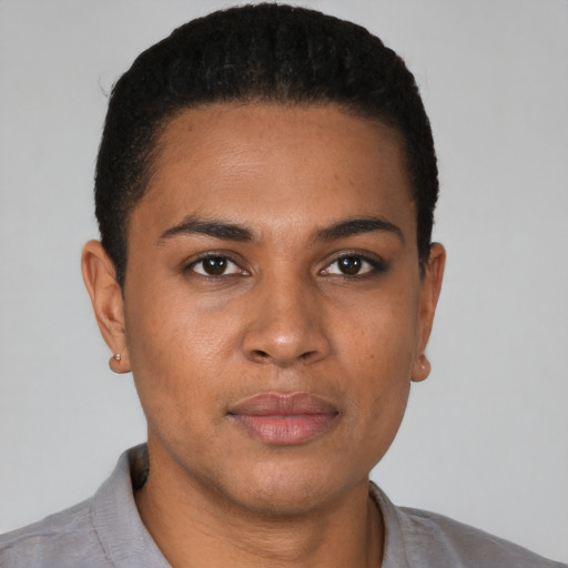 Joyful black young-adult male with short  black hair and brown eyes